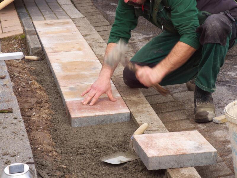 professional masonry contractor working on construction